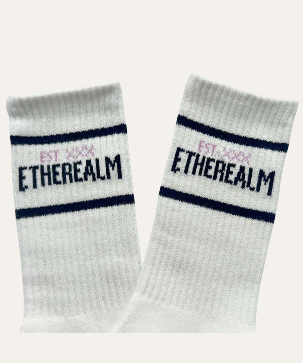Etherealm striped crew socks featuring bold text design and classic stripe details for style and comfort.