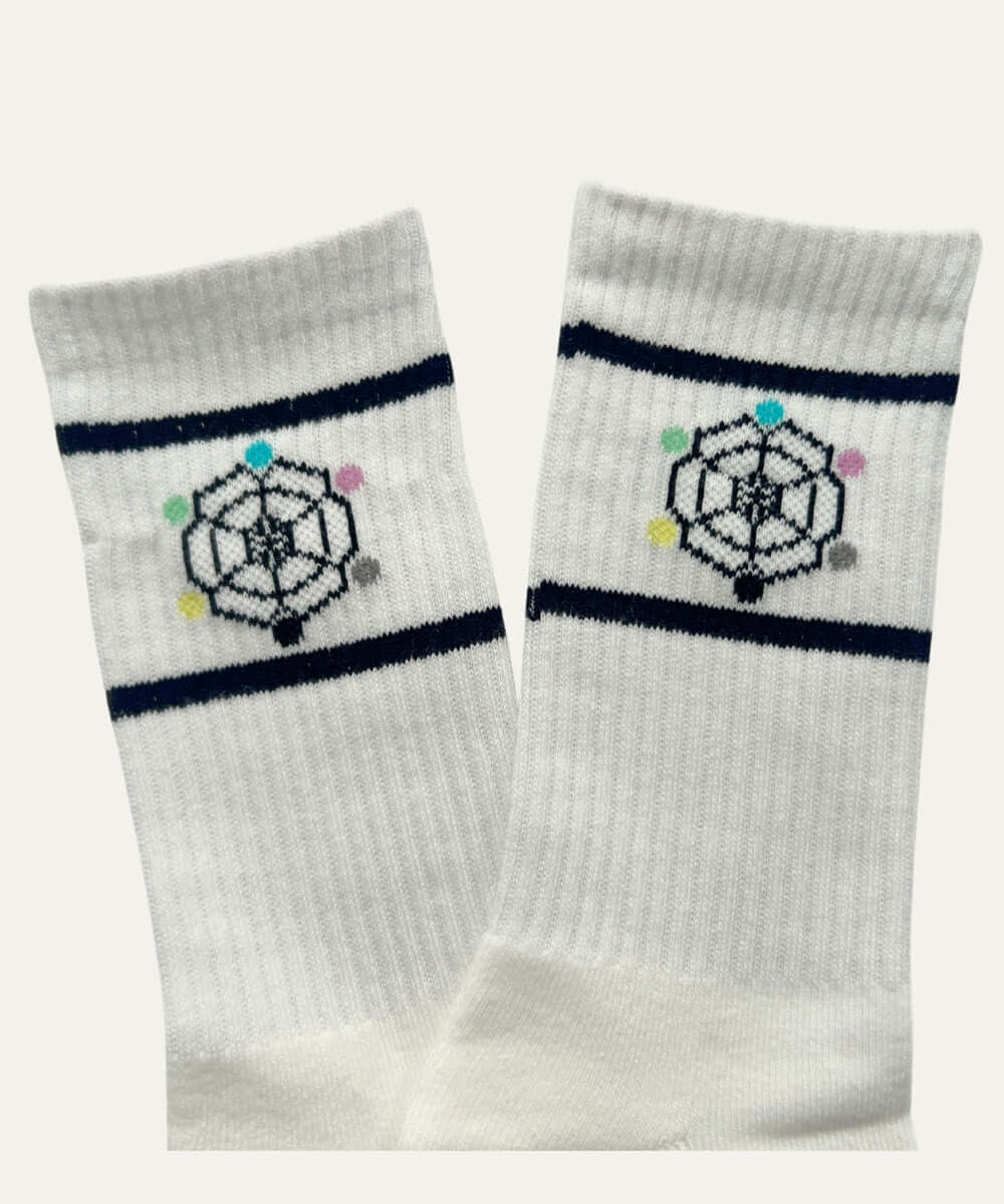 Geometric pattern crew socks in white with navy stripes, featuring a unique design for a modern style and all-day comfort.