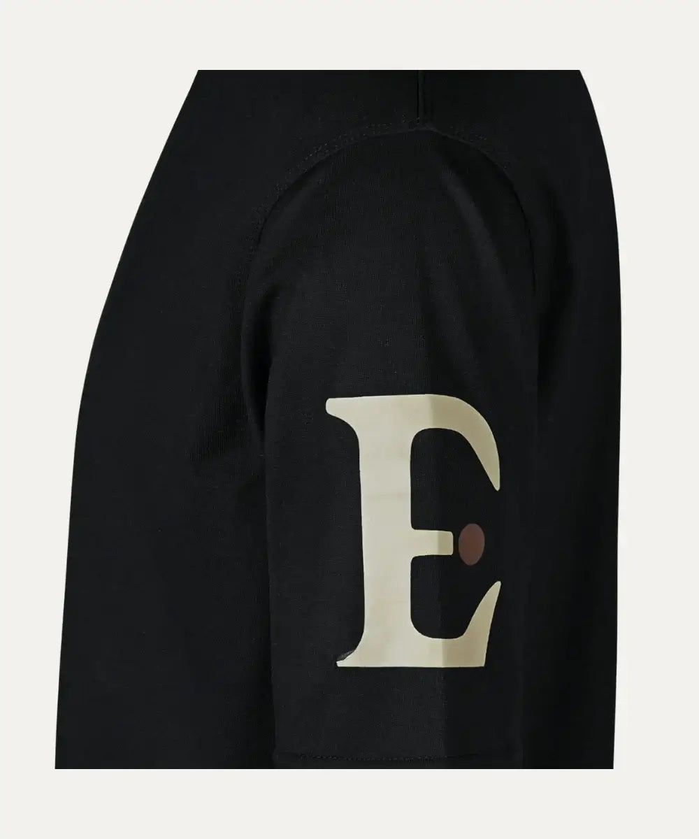 Side view of 'E' TEE showcasing soft cotton fabric and sleek logo on the sleeve, ideal for everyday wear.