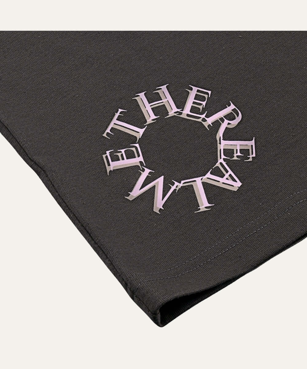 Etherealm Cyle Tee featuring soft fabric and circular logo, ideal for everyday wear in a minimalist style.